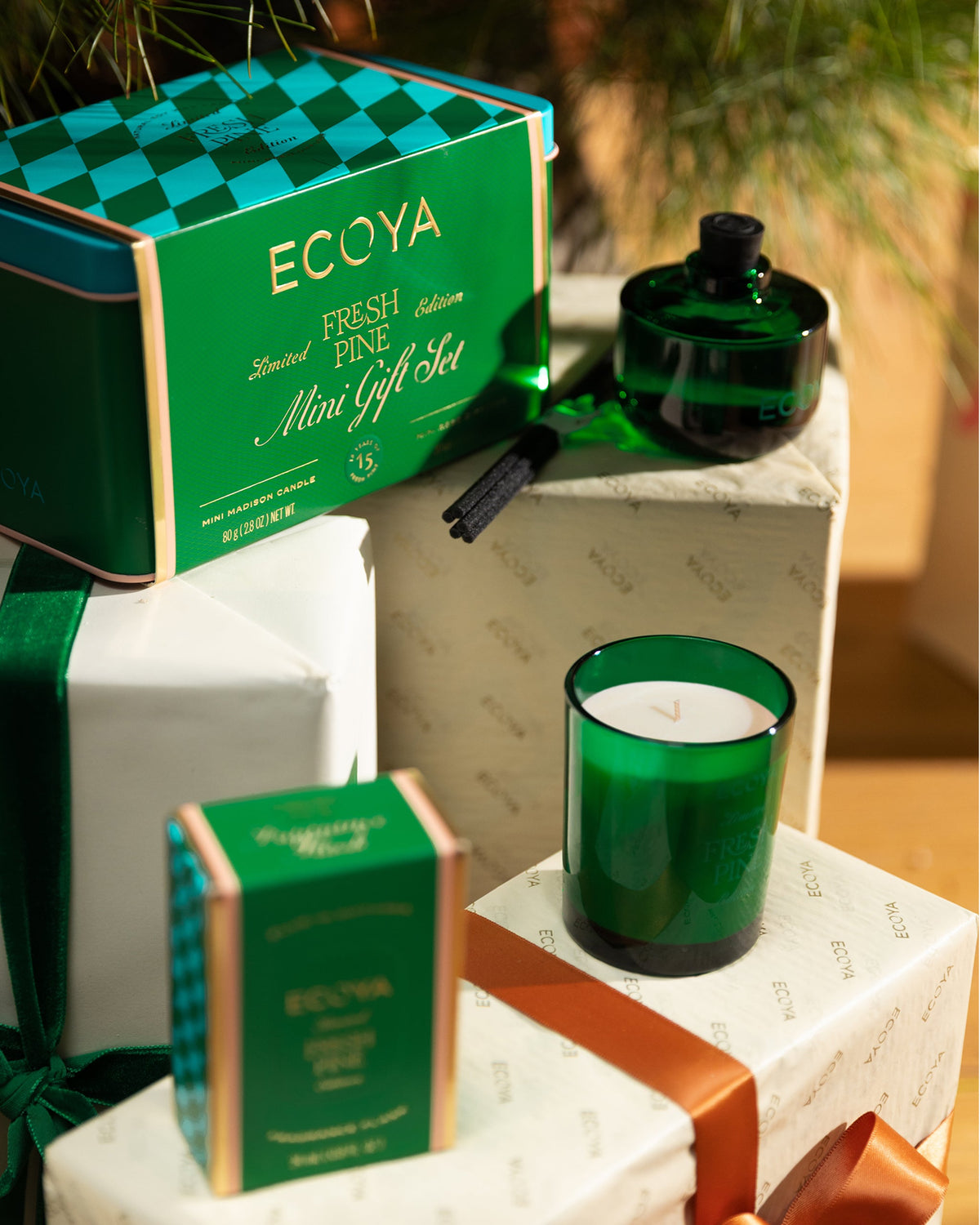 Ecoya Fresh Pine Mini Gift Set tin and mini candle styled among wrapped presents