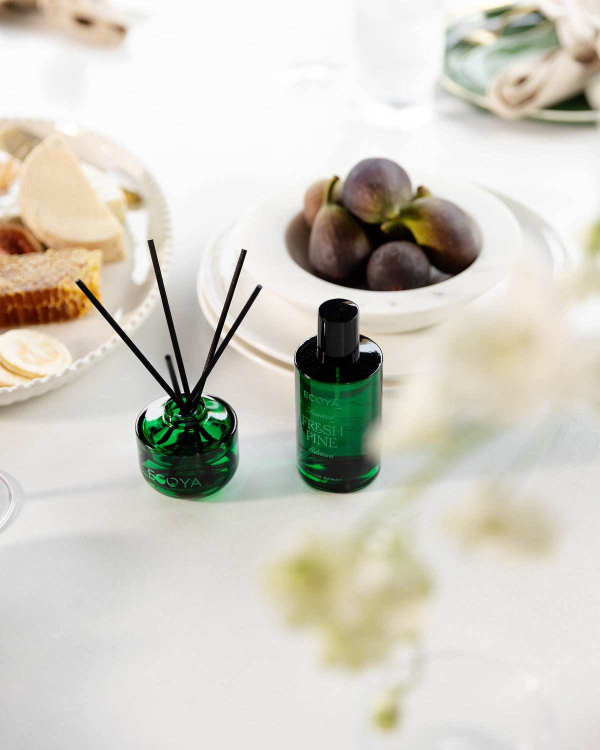 Ecoya Fresh Pine room spray and mini reed diffuser on a white festive table