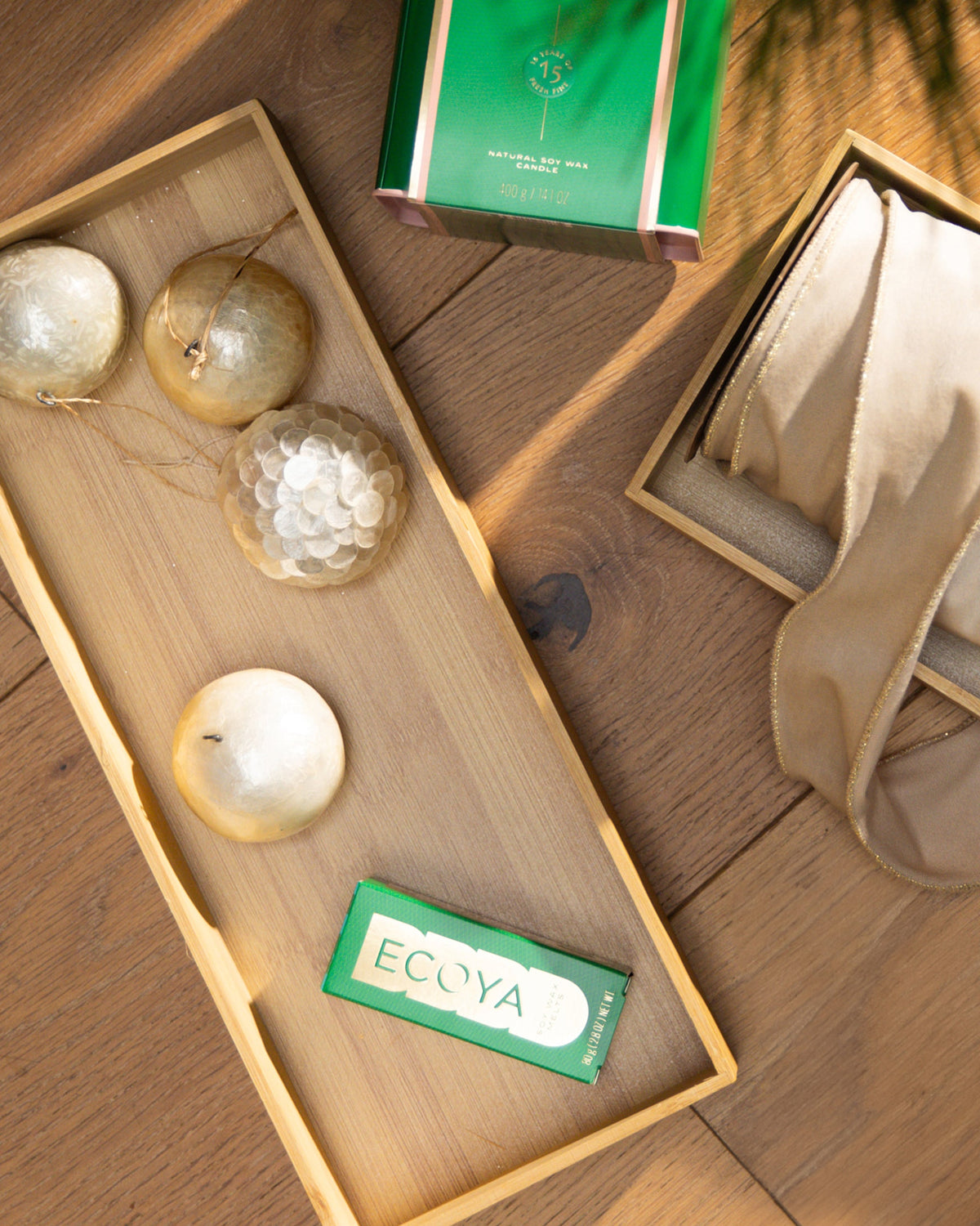Ecoya Fresh Pine wax melts on a timber tray with glass baubles