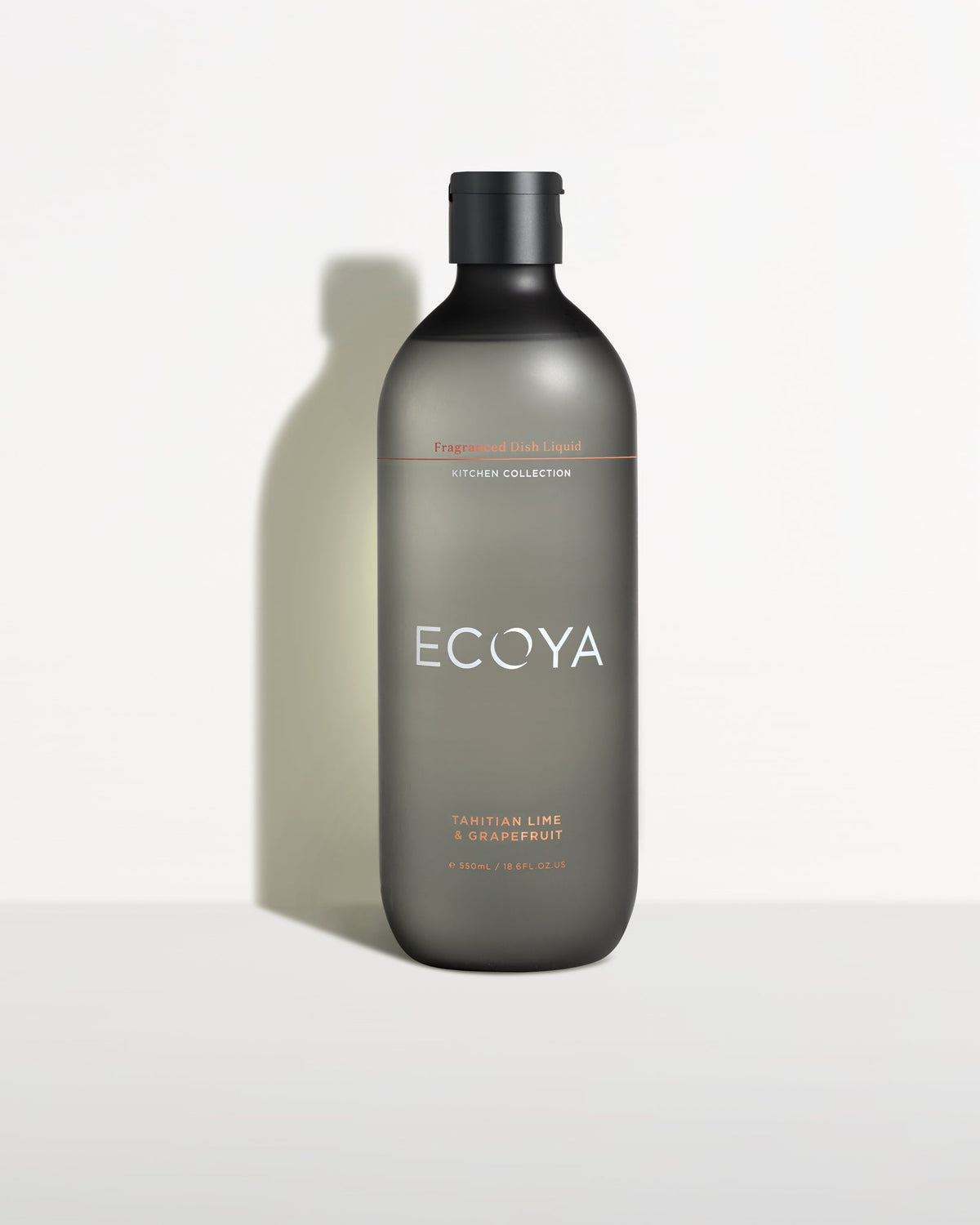 Ecoya dish liquid in a frosted grey-green bottle against a pale backdrop