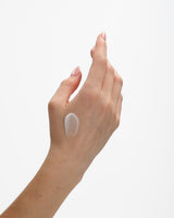 Ecoya Mandarin Gin Hand Sanitiser gel-to-water drop on the back of a hand
