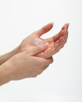 Ecoya Mandarin Gin Hand Sanitiser rubbed between two hands, absorbing with no residue