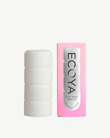 ECOYA Electric Wax Melter in white ceramic beside Sweet Pea & Jasmine Soy Wax Melt pink box packaging on a neutral background.