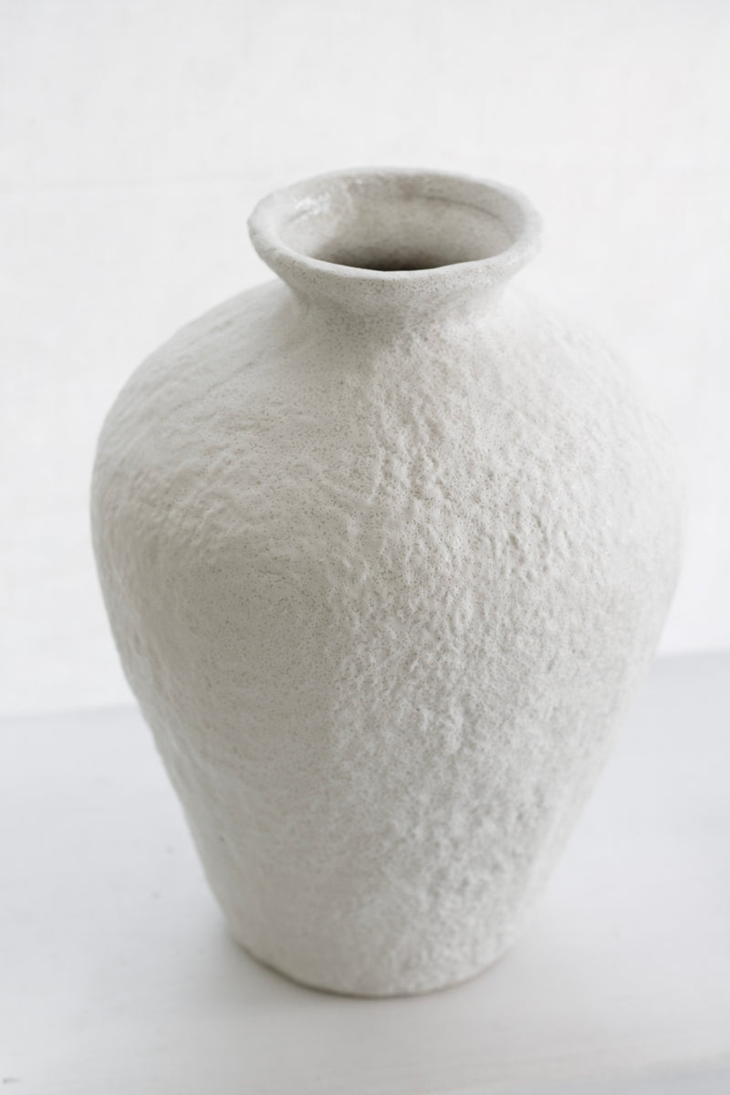 Eleni vase displayed in a light-filled room with a soft minimalist aesthetic