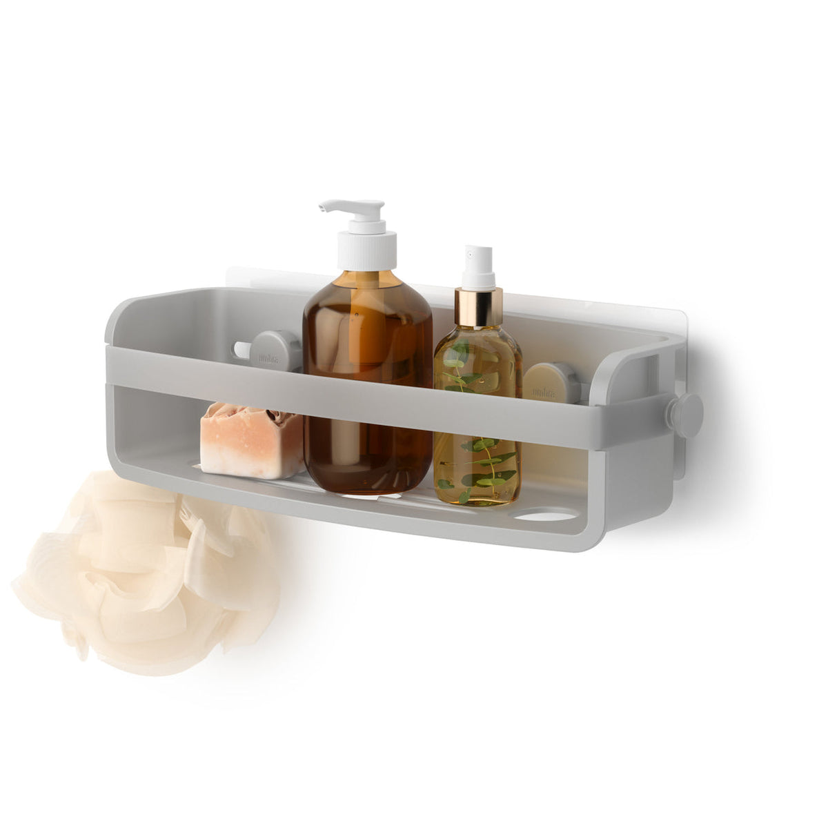 Umbra Flex shower bin in grey holding bath bottles, soap and a sponge