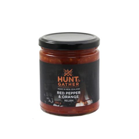 A jar of HUNT AND GATHER RELISH - SPICY RED PEPPER & ORANGE 290GR that promises a fiery BBQ taste sensation.