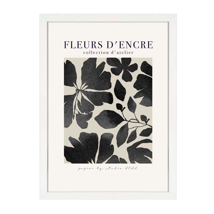 Fleurs d'Encre Print Black by Papier HQ in a white frame, black ink-washed leaves and flowers under a Fleurs d'Encre heading
