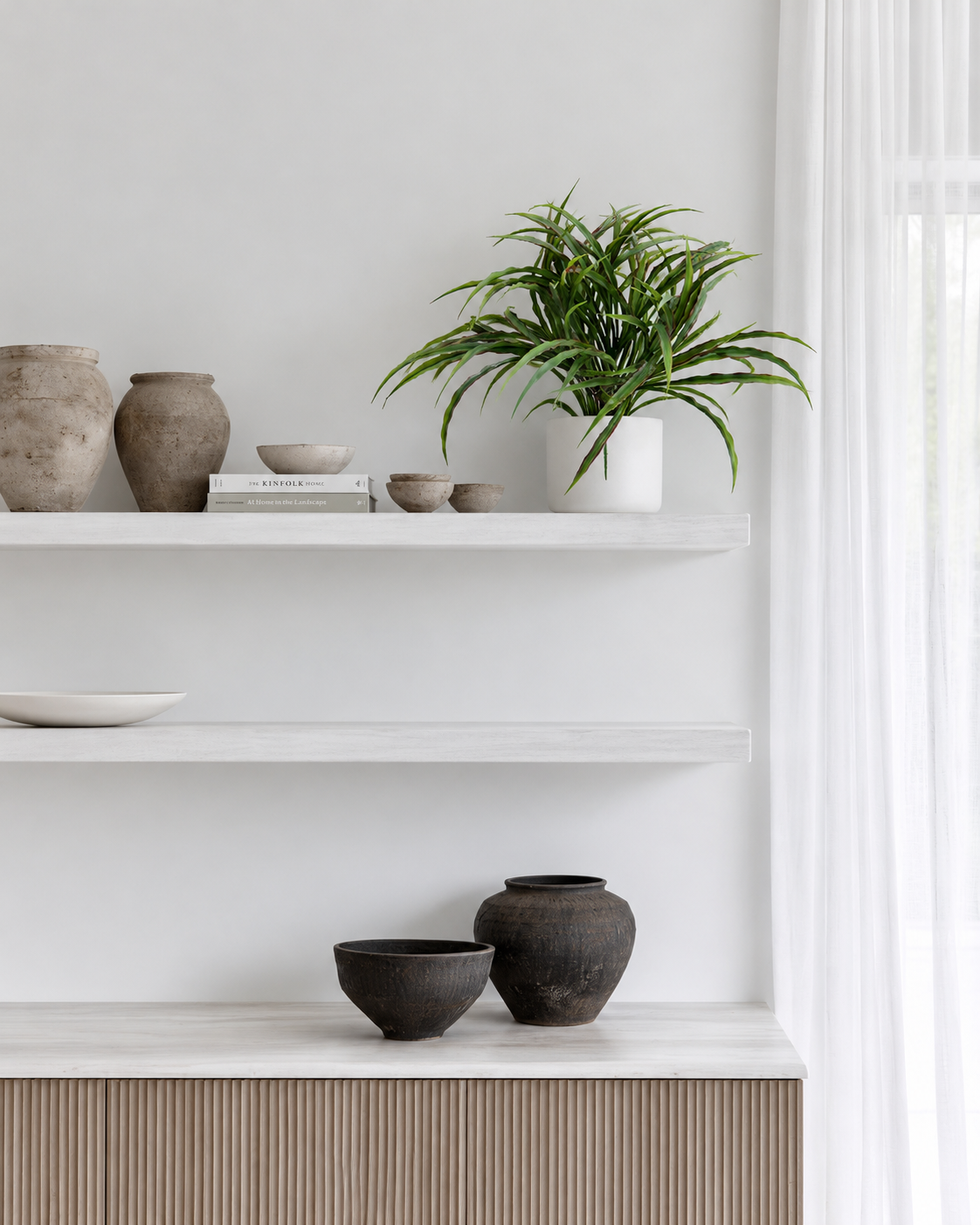 Vanilla grass bush on an open wall shelf above a bathroom vanity