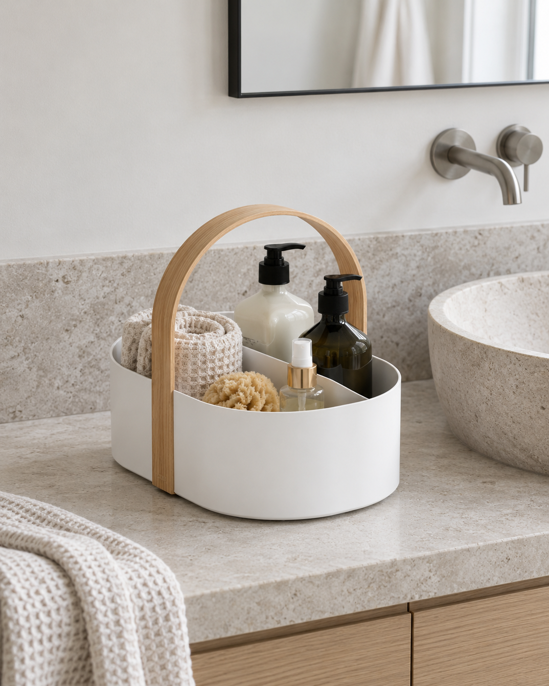 Umbra Bellwood caddy styled in a room: bathroom vanity with rolled towels and plain bottles