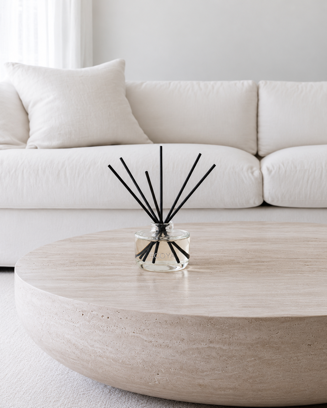 Fragranced Reed Diffuser by Ecoya, Mini 50ml or Large 200ml in French Pear styled on a coffee table