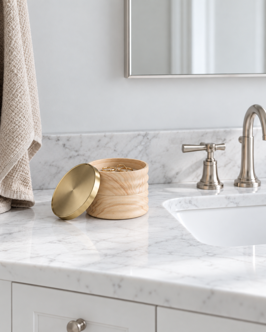 Tesora Storage Box, Natural and Brass styled on a marble bathroom vanity beside the tap