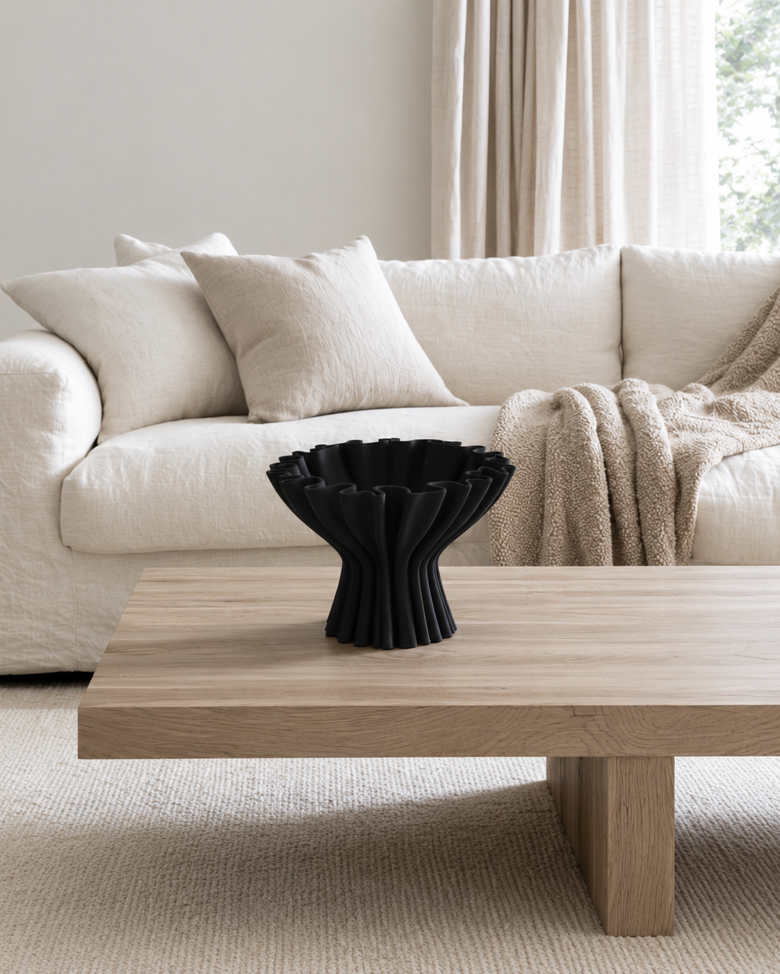Cleo 3D Printed Compote Vase in Black, White or Grey in Black styled on a coffee table