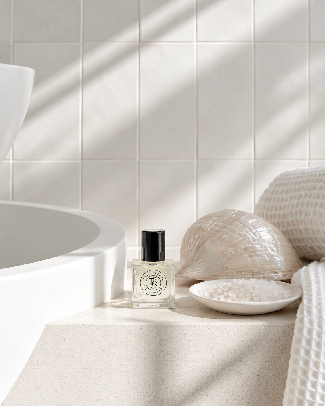 JEWEL Perfume Oil on a stone bathroom ledge