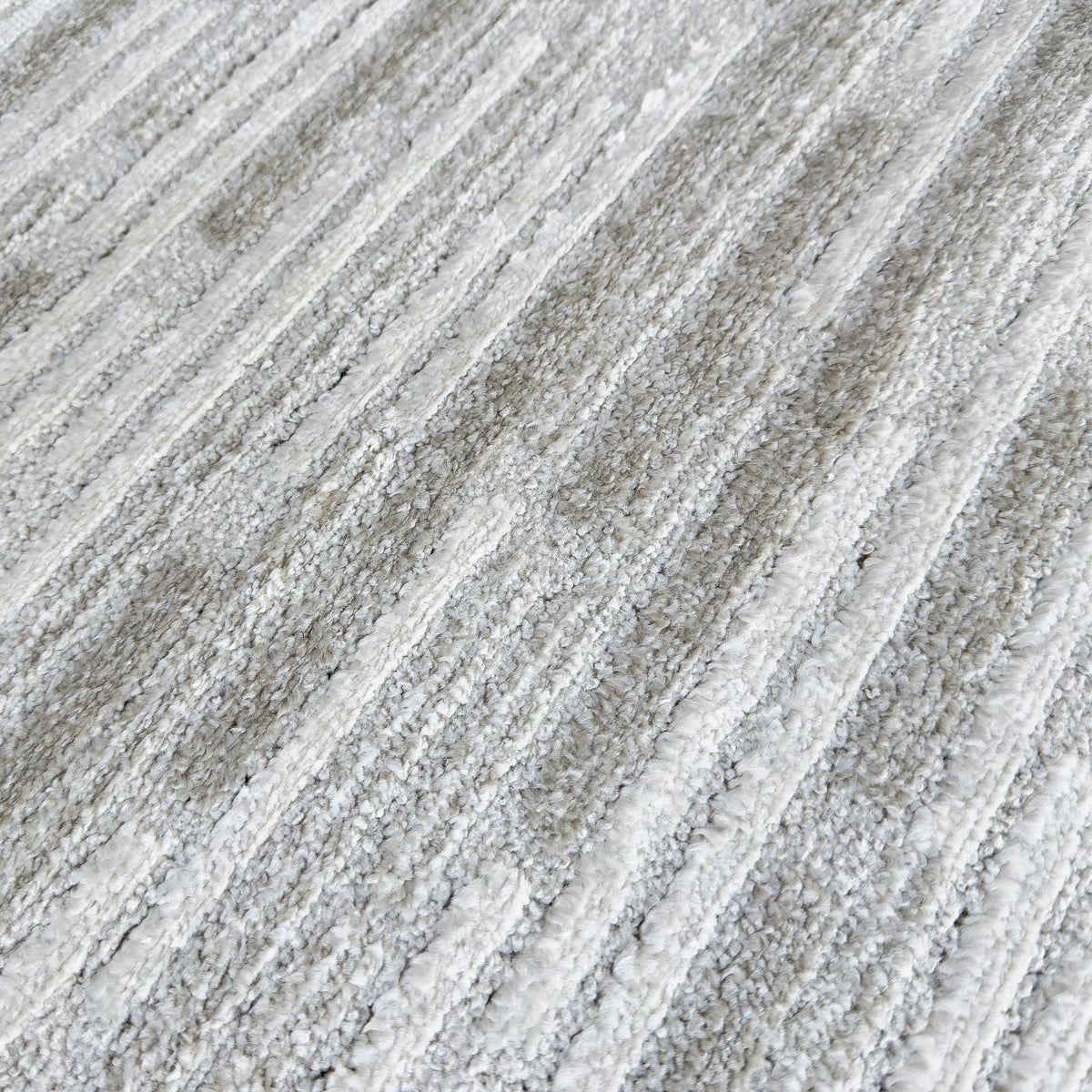 Close view of the streaked beige and grey pile texture
