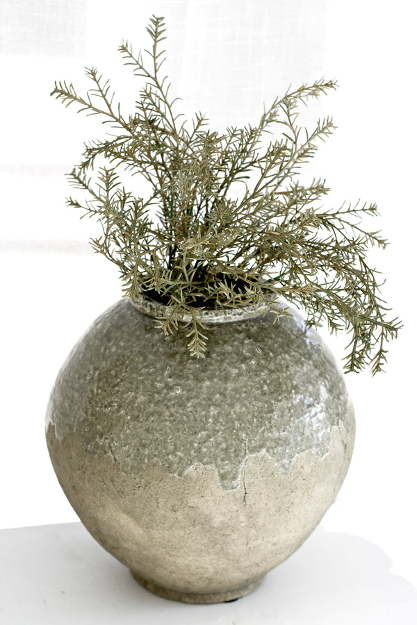 Textured stoneware moon vase with rustic BR/GR glaze, styled with greenery for modern coastal and rustic interiors.
