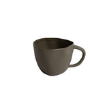 Natural stoneware Haan Mug with curved silhouette and matte finish