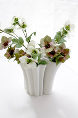 Artificial hellebore flowers in cream and mauve styled in white 3d printed ceramic vase