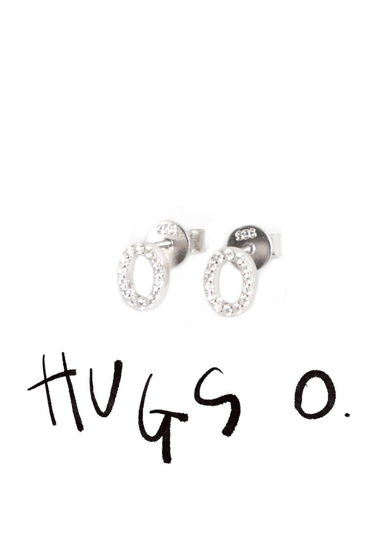 Hugs Studs on white above the handwritten words Hugs O