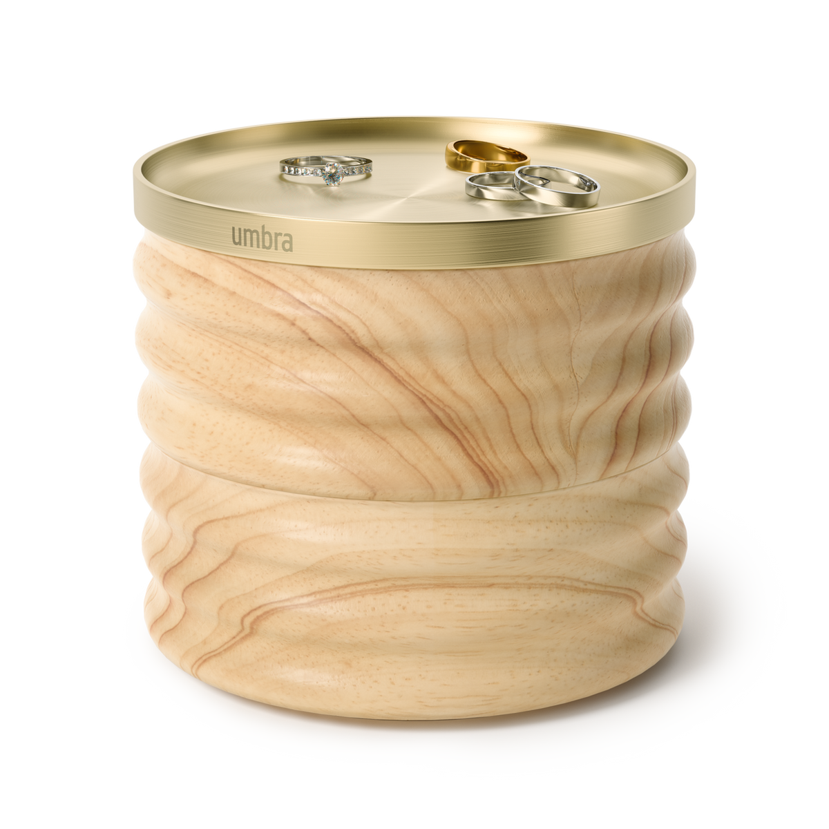 Umbra Tesora storage box in natural ash with rings resting on the brass lid