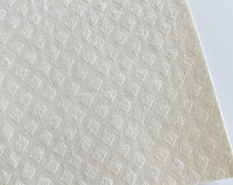 Swedish Dish Cloth in black folded on a bench