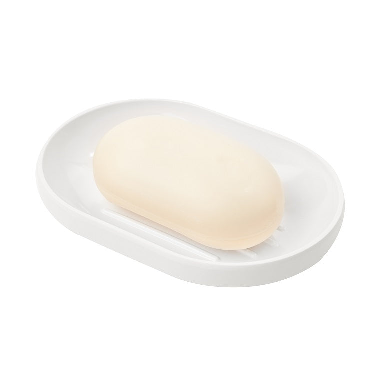 Umbra Step soap dish in white glossy melamine holding a bar of soap