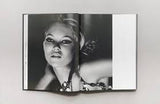 An open KATE: THE KATE MOSS BOOK with a photograph of a woman.