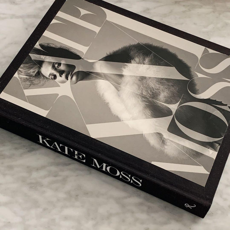 KATE: THE KATE MOSS BOOK by Books on a marble table.