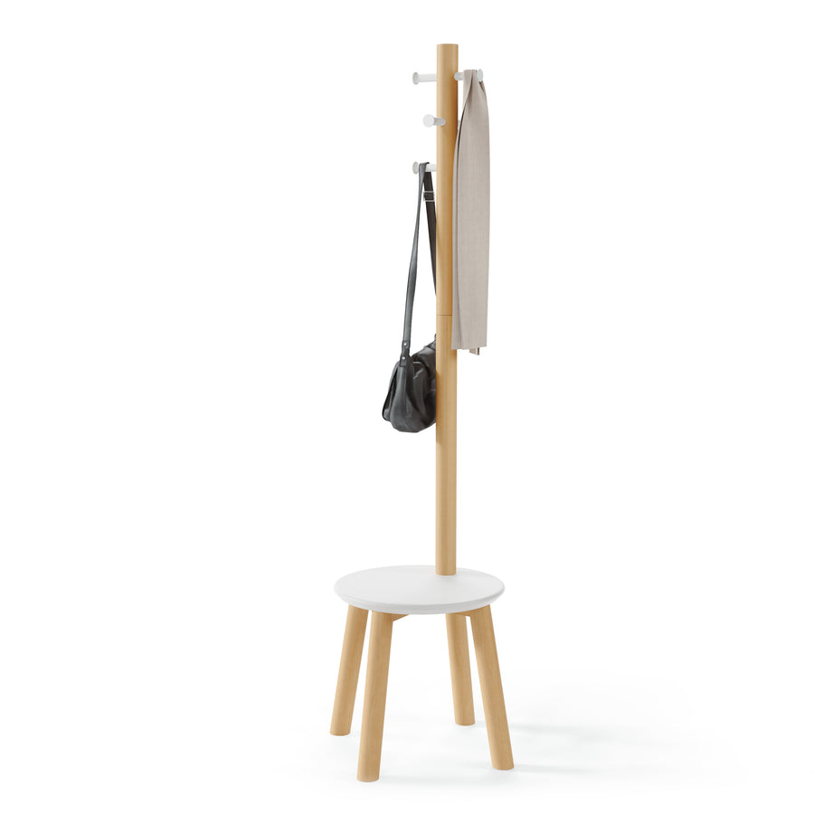 Umbra Pillar stool and coat rack in white and natural with a bag and garment hanging