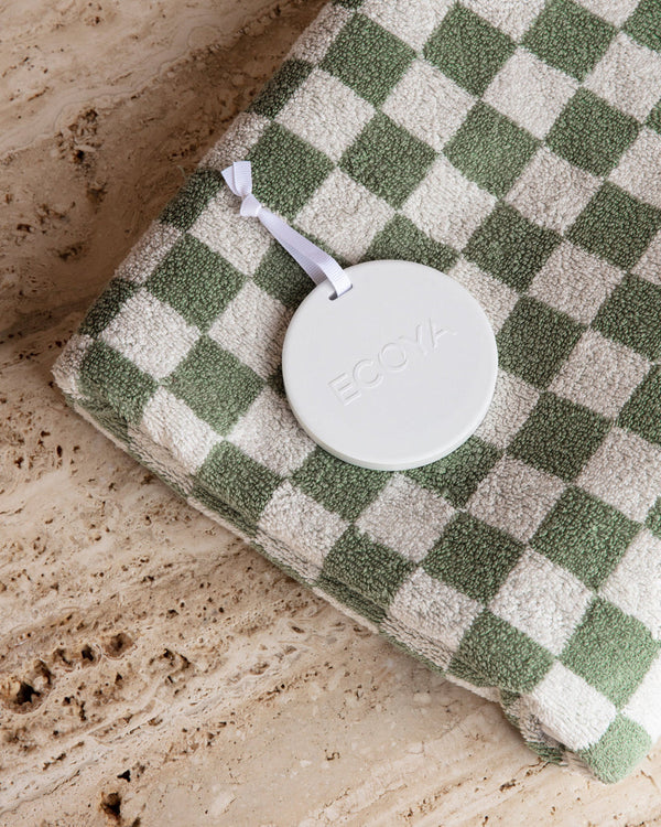 A fragrance-infused Ecoya Ceramic Stone towel with a stylish design.
