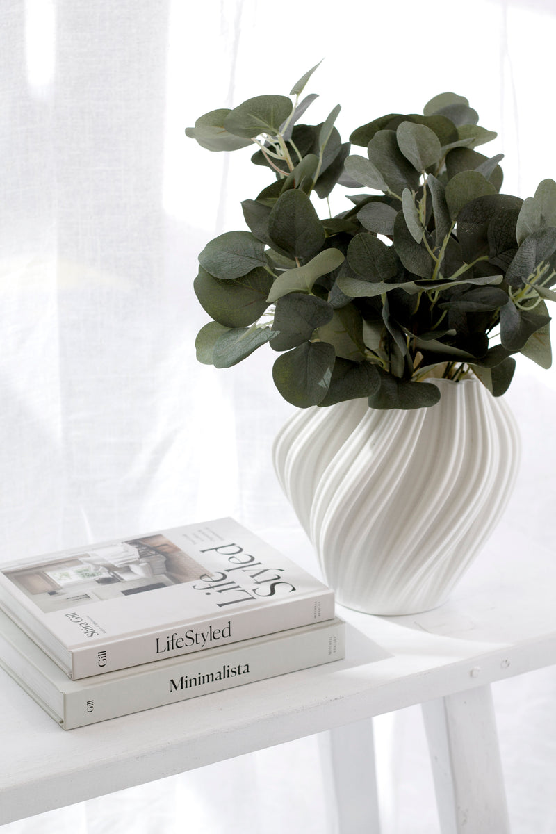 LifeStyled book by Shira Gill styled with greenery and Minimalista book, inspiring guide to minimalism and intentional living.