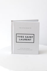 Little Guide to Yves Saint Laurent fashion book in white cover, minimalist coffee table styling