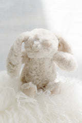 Littlefoot Bunny soft toy in biscuit styled in a calm, Scandinavian-inspired nursery