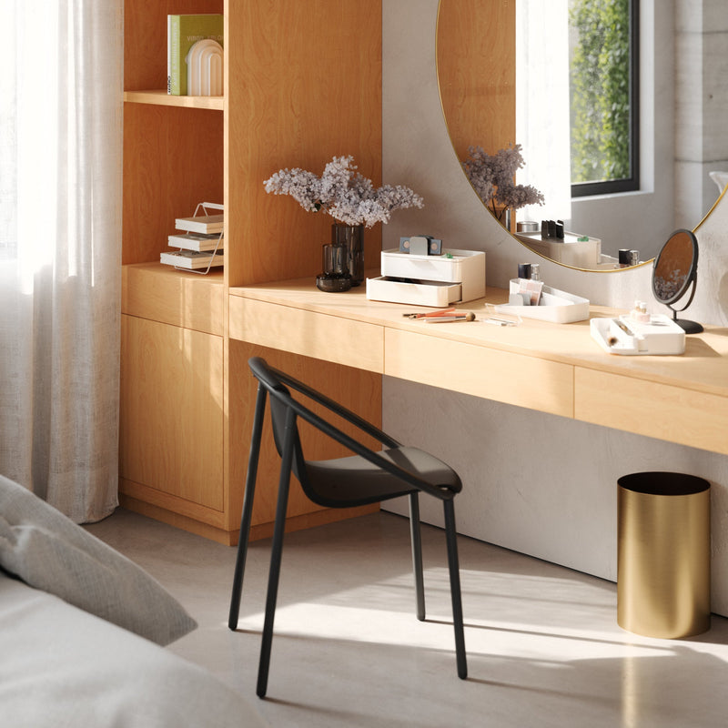 A bedroom with a bed, dresser, and mirror featuring the Umbra Glam Cosmetic Organizer Large - the ultimate beauty station.