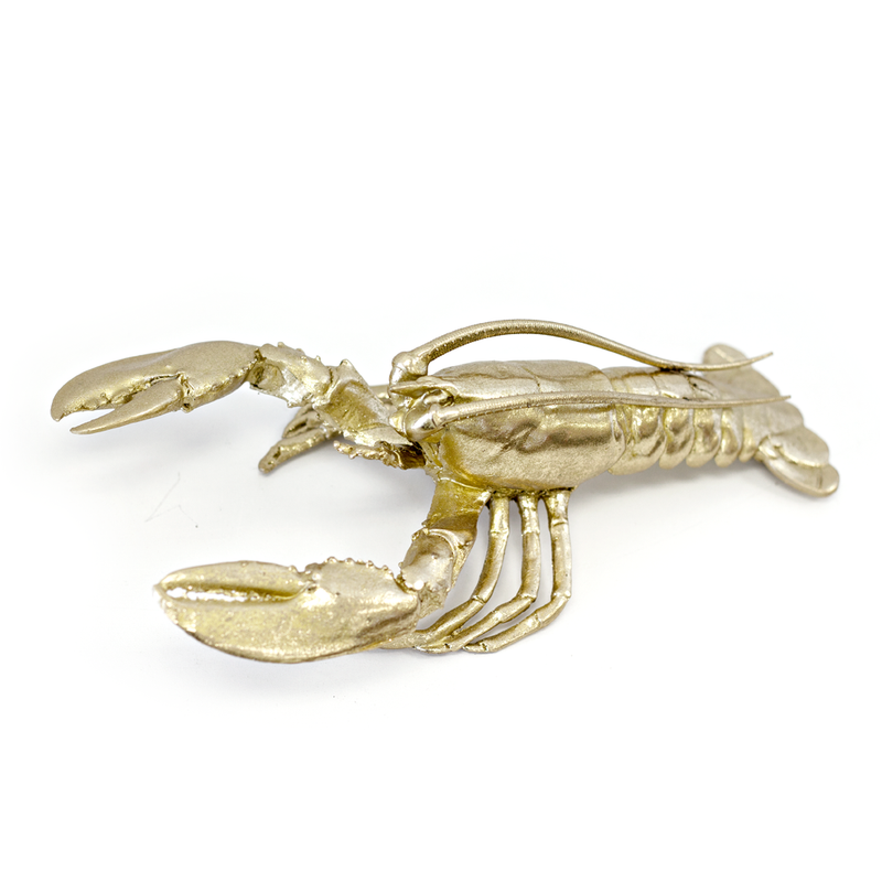 A gold Flux Home lobster ornament on a white background of Height and Width.