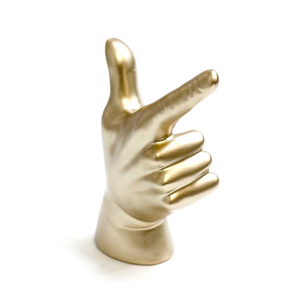 Glossy gold Lucky Hand sculpture with thumb and index finger raised, on a white background