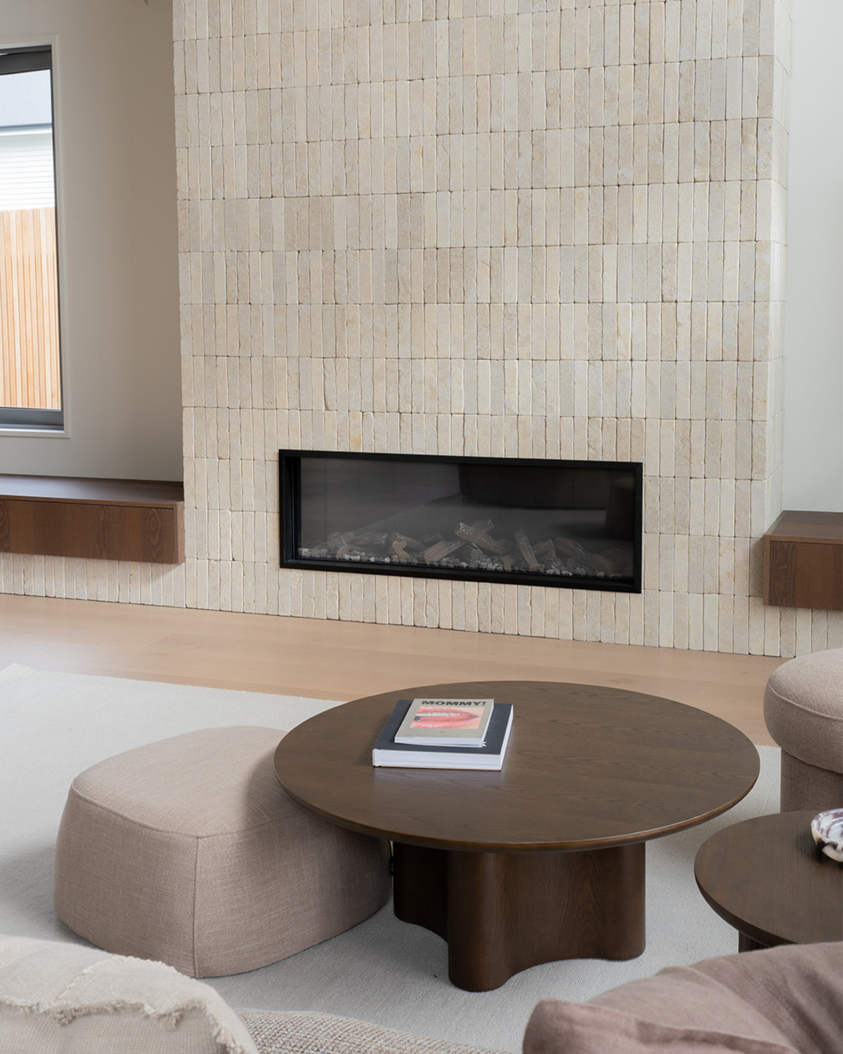 Living room with the Brown Oak Luma Coffee Table on a cream rug before a stone tiled fireplace