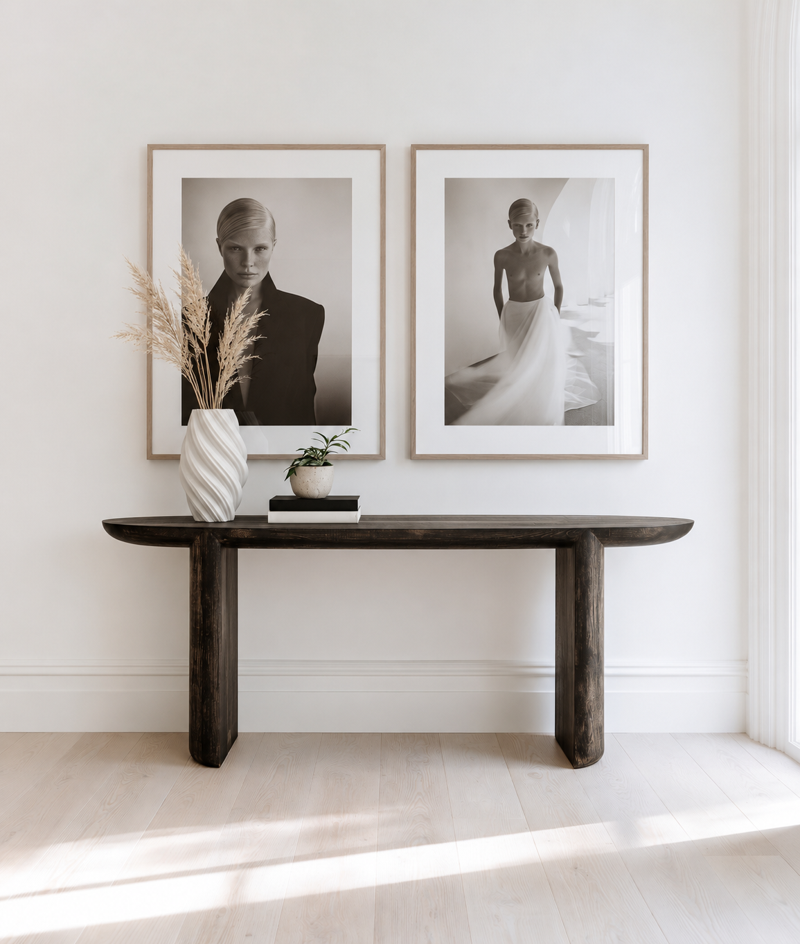Manon 3D ceramic vase in white with dried grasses on a dark timber console beneath framed prints