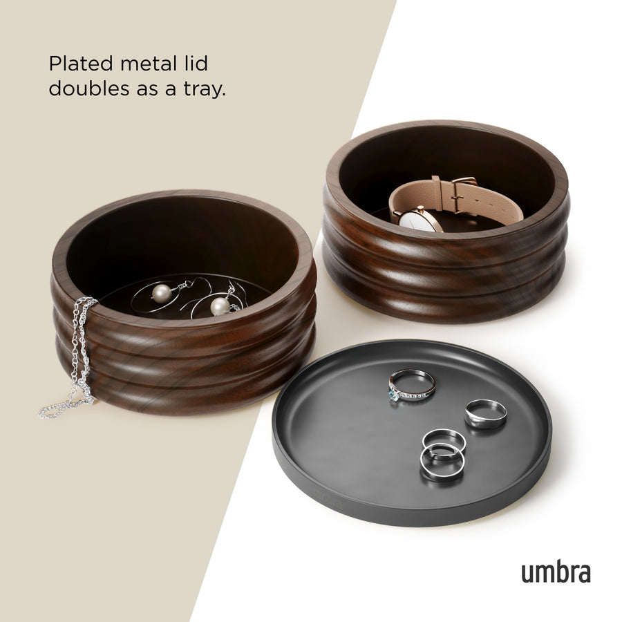 Umbra Tesora storage box in walnut with its black lid used as a ring tray