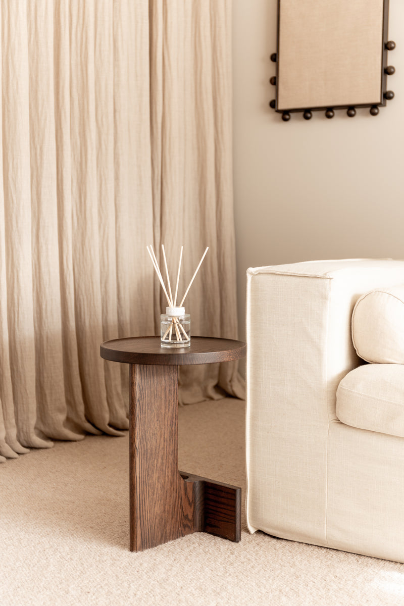 Naturals Coconut & Passion Berry diffuser on wooden side table, tropical refillable scent in glass bottle.