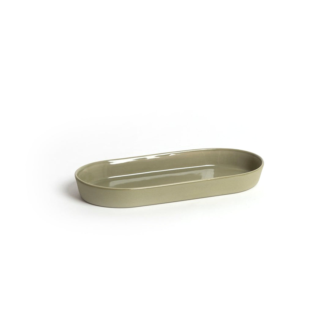 Noosa oval ceramic dish by Ned Collections in cashmere, styled on a neutral surface