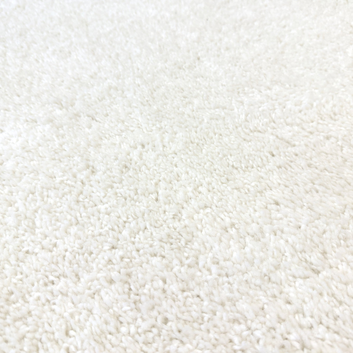 Close view of the soft chalk white plush pile