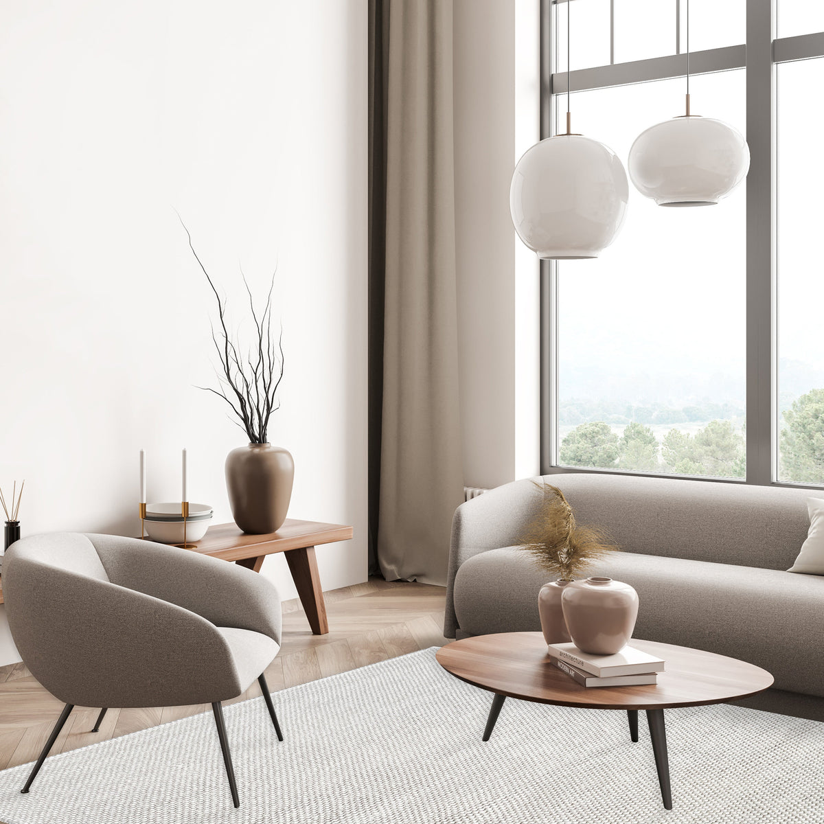 Ivory loop rug in a bright living room with a curved armchair, oval timber coffee table and globe pendants