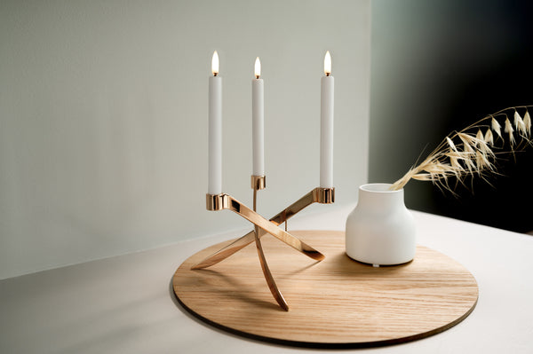 Three Uyuni Taper LED Candles - Set of 2 on a wooden tray with a special order item vase.