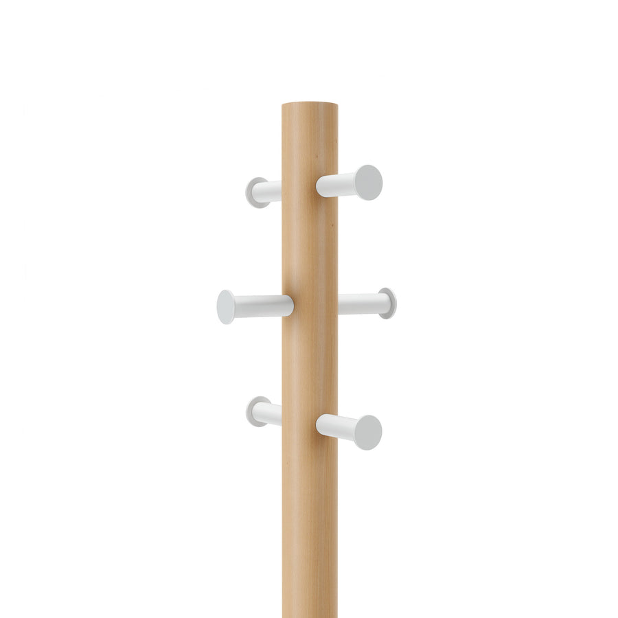Close-up of the white peg hooks on the natural Umbra Pillar coat rack