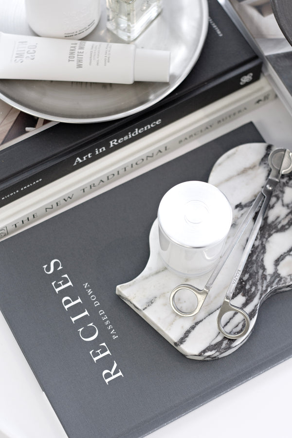 Flatlay of the Recipes Passed Down journal styled with marble, books, and kitchen accessories for an elevated modern look.