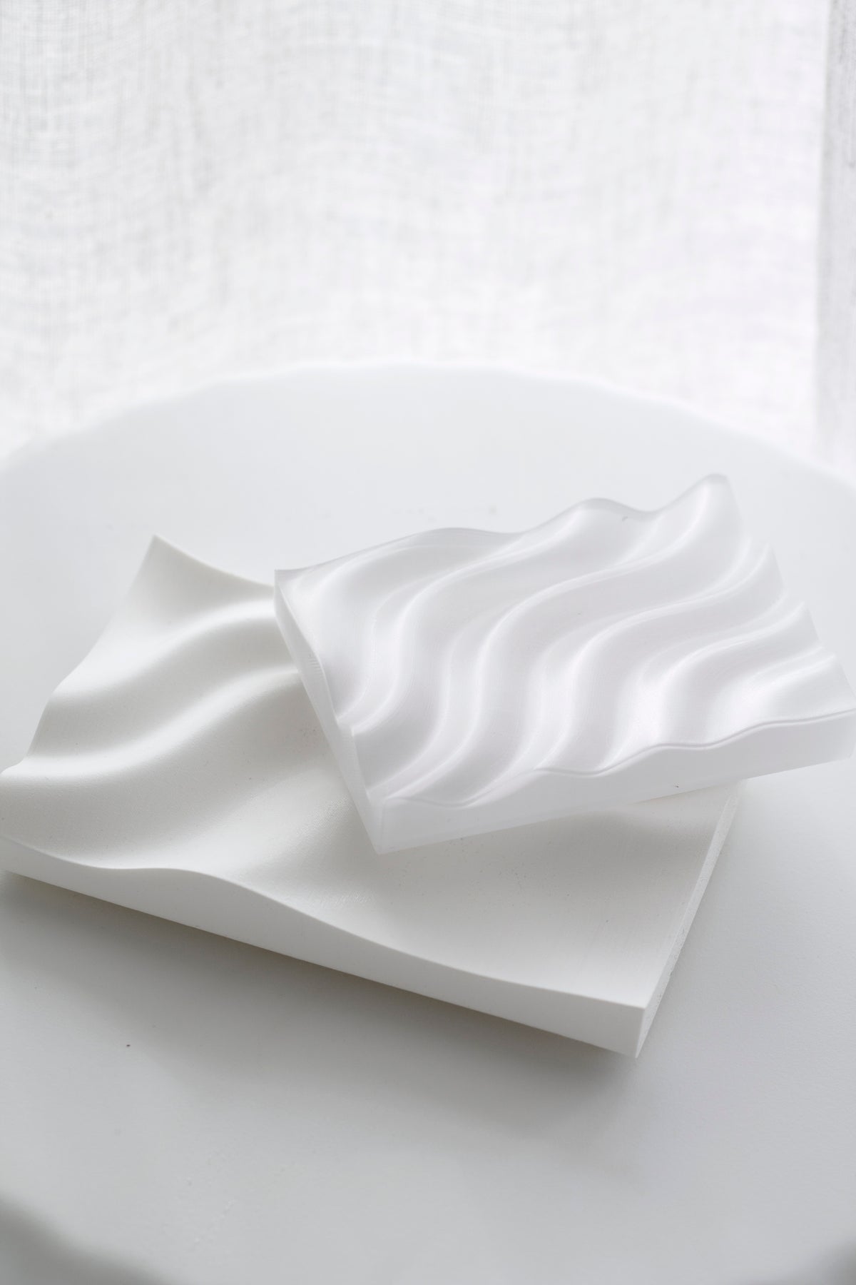Recycled plastic Ripple Soap Tray in clear finish holding artisanal soap, styled in a minimalist bathroom