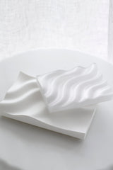 Recycled plastic Ripple Soap Tray in clear finish holding artisanal soap, styled in a minimalist bathroom
