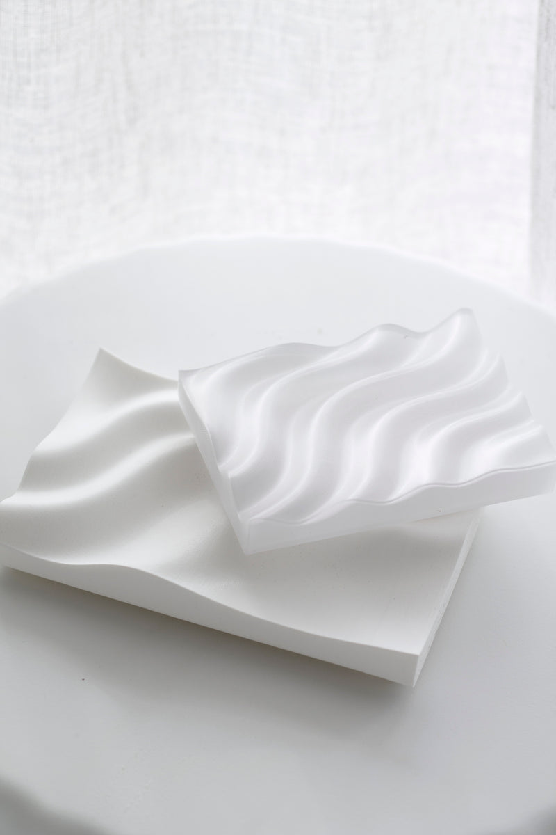 Recycled plastic Ripple Soap Tray in clear finish holding artisanal soap, styled in a minimalist bathroom