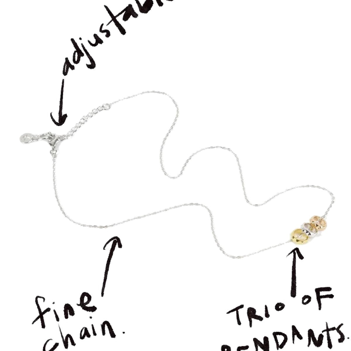 Rock Me Necklace with handwritten notes pointing to the adjustable fine chain and trio of pendants