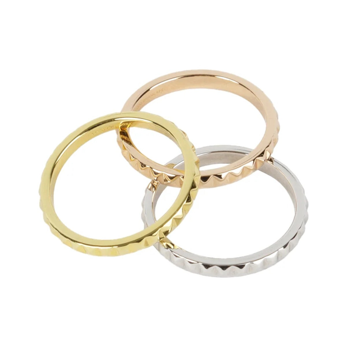 The three Rock Me stacker rings linked loosely together on white